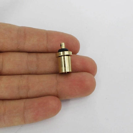 Copper Gas Tank Valve for Outdoor Burner, Camping Refill Accessory - compact copper refill valve held between fingers for camping stoves