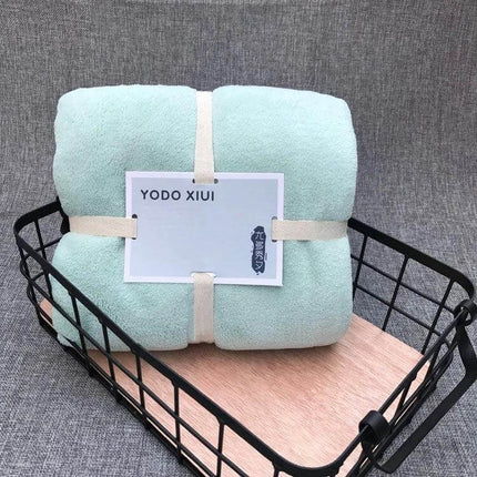 Coral Fleece Bath Towel, Wavy Edge, Quick Dry 70x140 cm neatly folded mint towel in a black wire basket, lightweight absorbent quick-dry bath towel