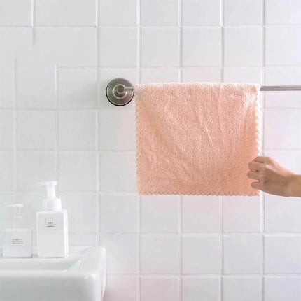 Coral Fleece Face Towel 30x30cm for Everyday Use at Home hanging on bathroom towel rack, soft pink plush texture