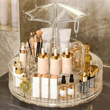 Cosmetic Storage Box With 360° Rotating Base For Easy Access displaying organized lipsticks, brushes, bottles and palettes on a clear rotating vanity organizer