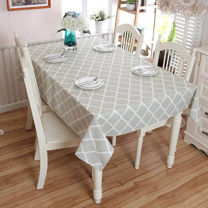 Cotton Geometric Rhombus Gray Lace Tablecloth For Everyday Dining on a small dining table set with plates, farmhouse decor, waterproof linen look