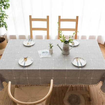 Cotton Linen Tablecloth With Square Lattice Embroidery, 140x300cm laid on wooden dining table with subtle dyed stripes and lattice embroidery