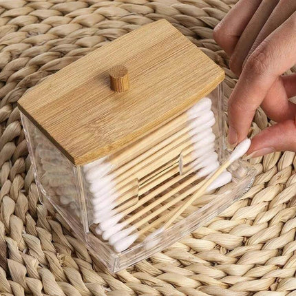 Cotton Swab Organizer, Acrylic Case With Bamboo Lid showing clear acrylic storage with natural bamboo lid holding cotton swabs on a woven mat