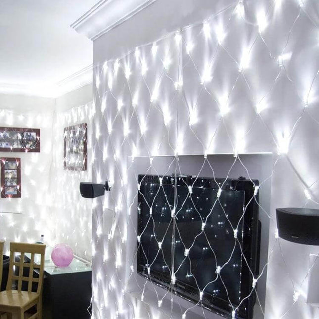 Curtain Net Lights For Outdoor Decor 4x6m 672 LEDs EU Plug draped over wall and TV creating soft white outdoor-ready illumination