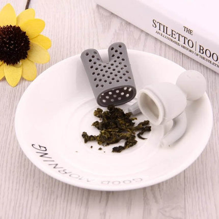 Cute Mr Tea Infuser Compact Silicone Tea Strainer For Everyday Tea gray bunny silicone infuser on plate with loose tea