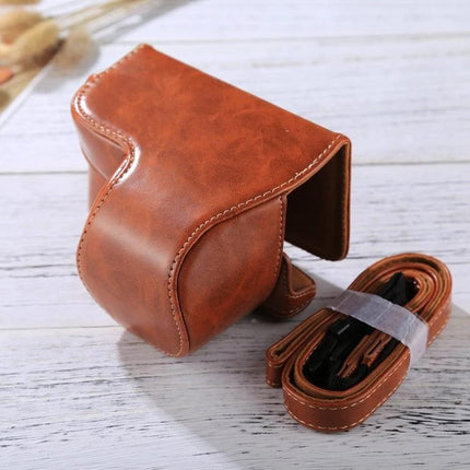 Durable PU Leather Protective Case with Strap for Sony Cameras in brown PU leather with matching strap, fitted for Sony A6000, dust and scratch protection