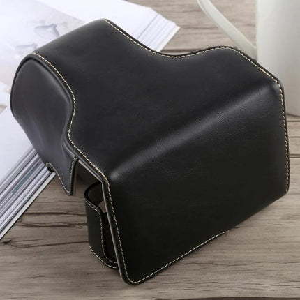 PU Leather Protective Case with Strap for Fujifilm X-A5 black PU leather camera case with white stitching on wooden table