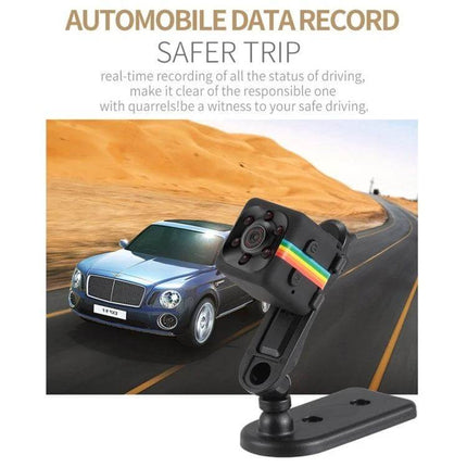 SQ11 Mini DV Camera with Night Vision for Outdoor Recording mounted as a car dash camera capturing road and desert scenery