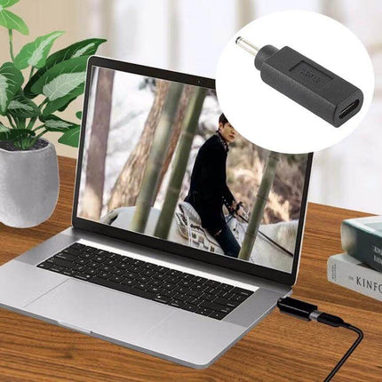 Compact USB-C Adapter for Portable Device Charging Connections plugged into laptop showing Type-C female to 3.0x1.0mm male converter