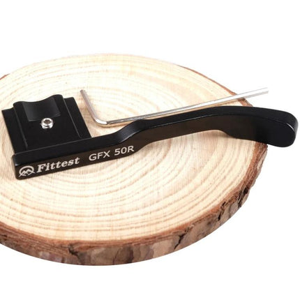 FITTEST Ergonomic Thumb Grip for Fujifilm GXF-50R Camera mounted on wood display with Allen key, black lightweight ergonomic thumb grip