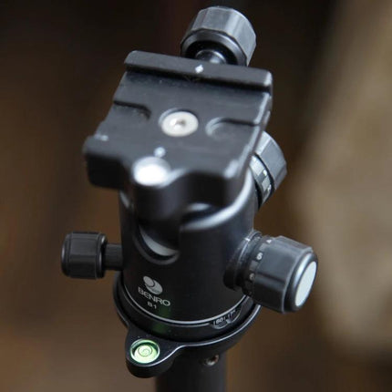 76mm Offset Spirit Level Plate for Tripod Ball Heads mounted on a Benro ball head showing bubble level and adjustment knobs