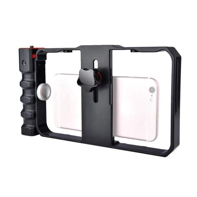 Handheld Cage for Smartphone Filming in Daily Life – black aluminum cage with side grip holding a pink smartphone for stable vlogging and casual video capture