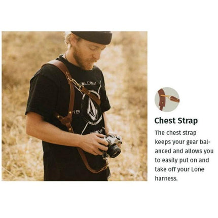 Adjustable Anti-Slip Leather Shoulder Harness for DSLR Cameras worn by photographer with chest strap for hands-free stable camera access