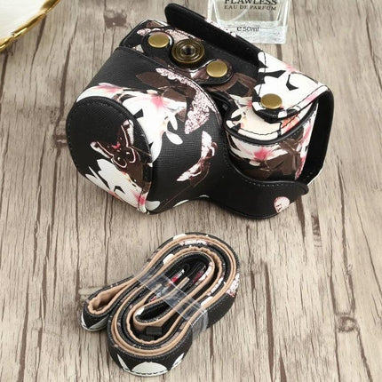 Flower Pattern PU Leather Protective Case for Sony Cameras with matching strap on wood surface