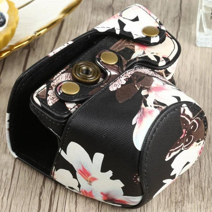 Flower Pattern PU Leather Protective Case for Sony Cameras on wood surface, floral PU leather camera cover with snap closure
