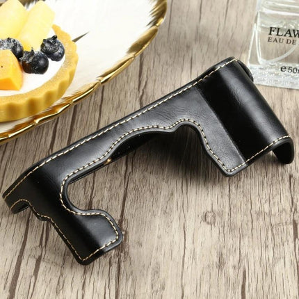 PU Leather Half Case with 1/4 Inch Thread for FUJIFILM X-T4 black stitched protective camera half case on wooden table