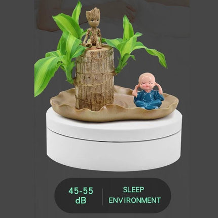 12cm Electric Rotating Display Stand for Product Showcasing rotating white turntable showcasing small planter and figurines