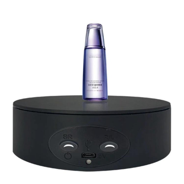 Xiaoai 13cm Electric Rotating Turntable for Product Displays showing a cosmetic bottle on a black rotating display base