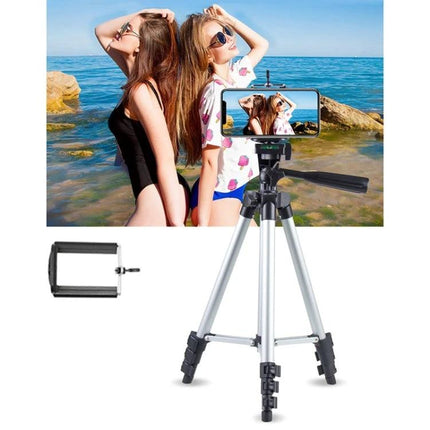 Adjustable Aluminum Tripod for DSLR and Digital Cameras with smartphone mount shown on beach portrait shoot