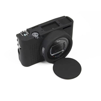 Durable Soft Silicone Protective Case for Sony Cyber-Shot Cameras in black fitted on compact camera with removable lens cap