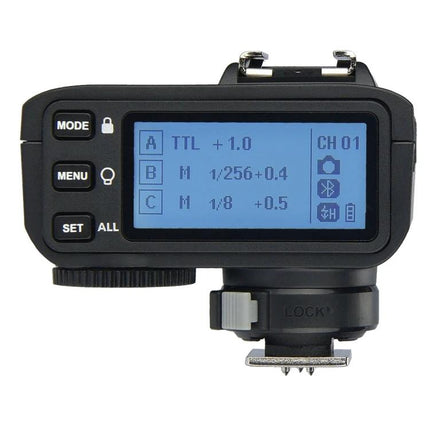 Godox X2T-C Bluetooth Wireless Flash Trigger for Canon Cameras showing LCD screen and control buttons for TTL and manual flash settings