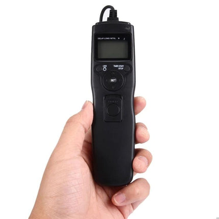 Shutter Release Remote with Interval Timer for Canon Cameras held in hand showing buttons and LCD for timed long-exposure control