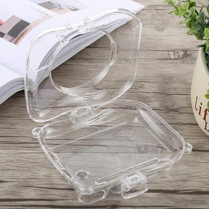 Crystal Protective Case with Strap for Fujifilm Instax Mini 25 clear hard-shell protective cover open on wooden table showing lens window and access to shutter