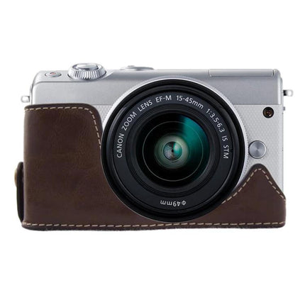 PU Leather Protective Half Case for Canon Cameras on silver Canon EOS M100 showing brown half case protecting camera body