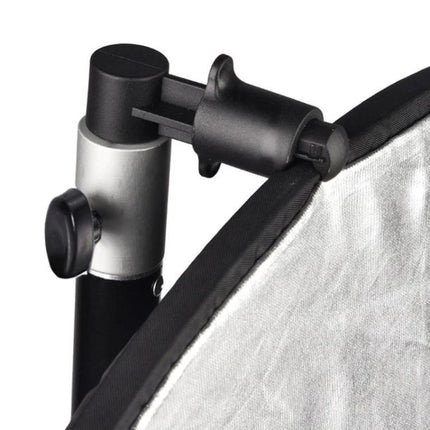 Reflector Holder Clip for Photography Studio Light Stands securely attached to light stand holding a silver reflector for portrait and product shoots