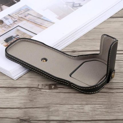 Classic PU Leather Protective Half Case for Canon DSLRs shown in brown PU leather with stitching and brass screw mount