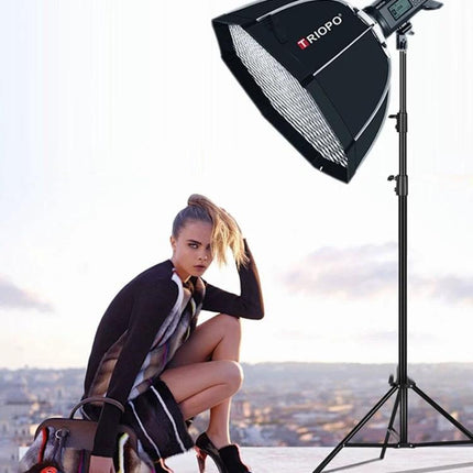 Triopo 65cm Honeycomb Octagon Softbox for Studio Lighting mounted on a stand illuminating a fashion portrait shoot