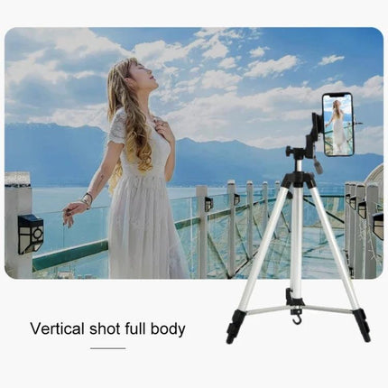 Aluminum Alloy Live Broadcast Tripod with Adjustable Height capturing full-body vertical shot of vlogger on balcony with lake and mountains