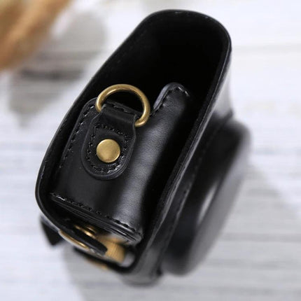 PU Leather Protective Case with Strap for Canon PowerShot Cameras showing black leather side view with brass strap ring and secure snap