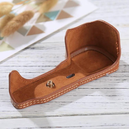 PU Leather Protective Half Case for Sony A6000 Camera in brown faux leather with stitched edges, showing bottom mount and interior lining