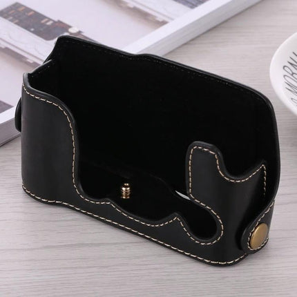 PU Leather Half Case with 1/4 Inch Thread for Fujifilm X-A3 and X-A10, black stitched protective half case on table, 1/4-inch screw visible