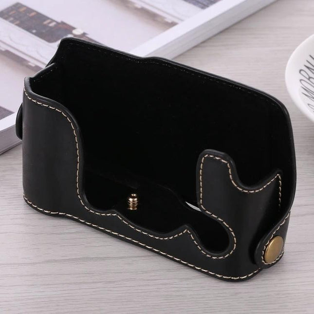 PU Leather Half Case with 1/4 Inch Thread for Fujifilm X-A3 and X-A10, black stitched protective half case on table, 1/4-inch screw visible