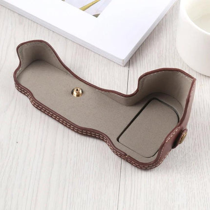 PU Leather Half Case for Nikon Z Series Cameras with Tripod Mount brown PU leather half case open showing tripod screw and battery access