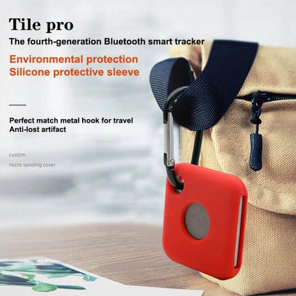Silicone Protective Cover for Tile Pro Bluetooth Tracker - red silicone sleeve with metal hook attached to bag, protects Tile Pro from drops