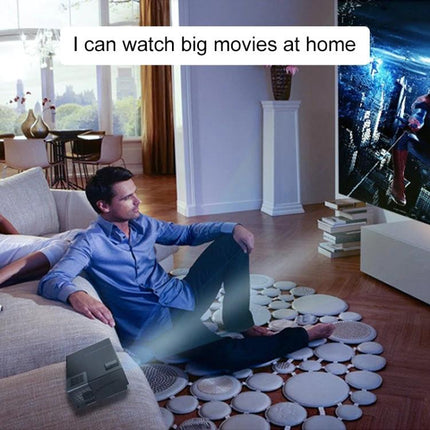 Cheerlux CL770 Smart Projector for Movies and Presentations showing a man watching a large home movie projection in a living room