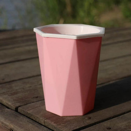 Diamond-Shaped Self-Watering Flower Pot, 12x14 cm Plastic pink diamond-shaped plastic planter on wooden table, with inner planting basket and cotton rope setup