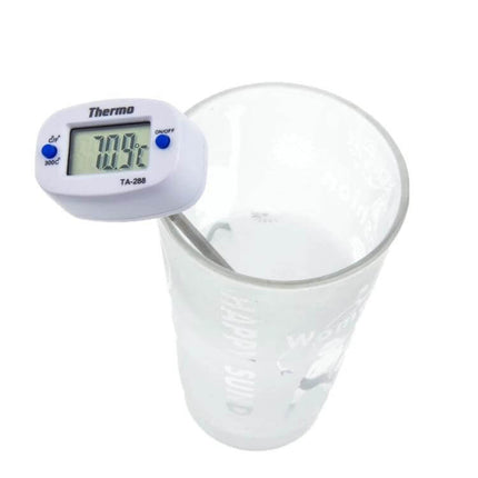 Digital Thermometer For Kitchen Lab And BBQ With 150mm Sensor Wire showing probe in a measuring cup, LCD reading for culinary and lab use