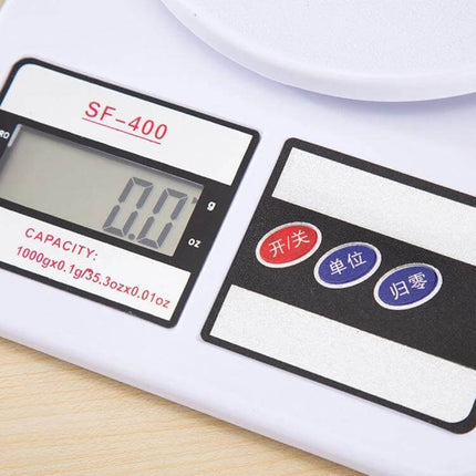 Digital Portable Kitchen Scale for Everyday Ingredient Measuring showing LCD display at 0.0 and control buttons on white ABS body