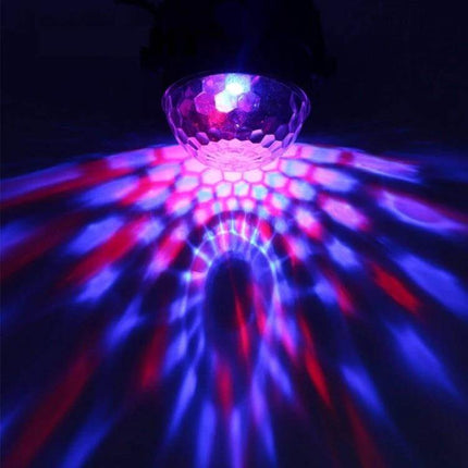 Disco Ball Party Light Sound Activated For Parties And Events projecting rotating RGB red blue green patterns on ceiling for birthdays and dance nights