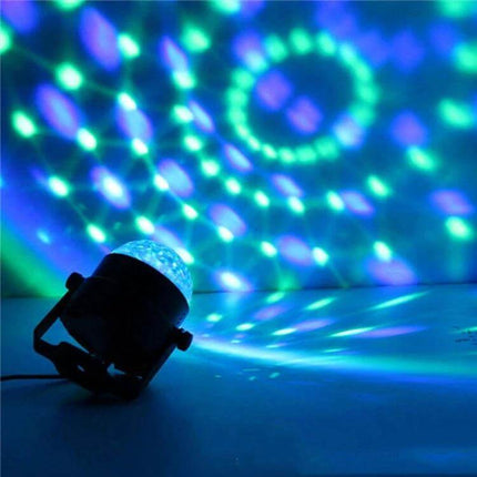 Disco Ball Party Light Sound Activated For Parties And Events projecting rotating RGB patterns on wall and ceiling for parties and weddings