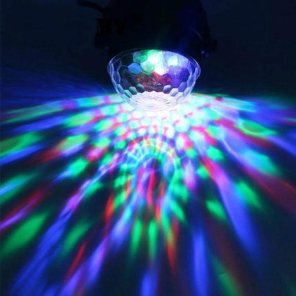 Disco Ball Party Light Sound Activated For Parties And Events projecting rotating RGB effects on wall and floor, compact 3W sound-activated party light
