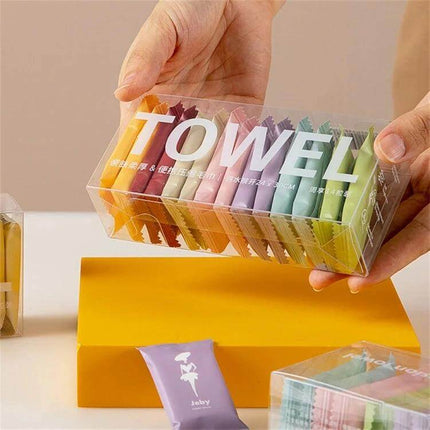Disposable Compressed Towels 14 Pack For Travel And Daily Use - clear box of colorful compressed cotton travel towels for makeup removal and refreshing wipes