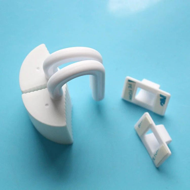 Door Seam Protector Anti-Pinching Safety Stopper For Doors white plastic clip on blue background, protects fingers and door seams