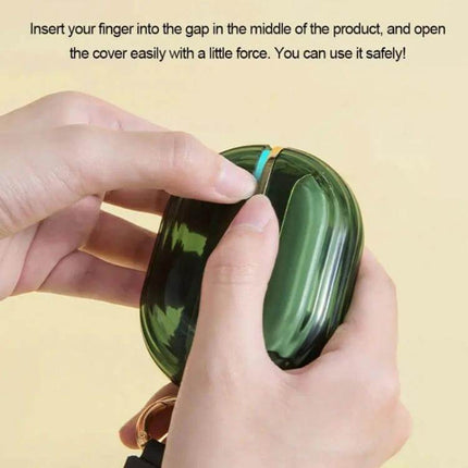 Double-Sided Clothing Lint Remover Roll for Clothes compact green case held in hands showing how to open cover for refilling and use