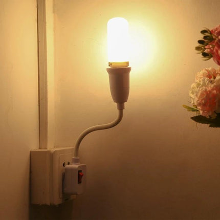 E27 Bulb Holder Extension With Switch For Home Lighting plugged into wall outlet with illuminated bulb and reachable on/off switch