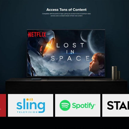 Xiaomi 4K HDR Google TV Streaming Media Player connected to TV showing Netflix Lost in Space and app icons like Sling and Spotify